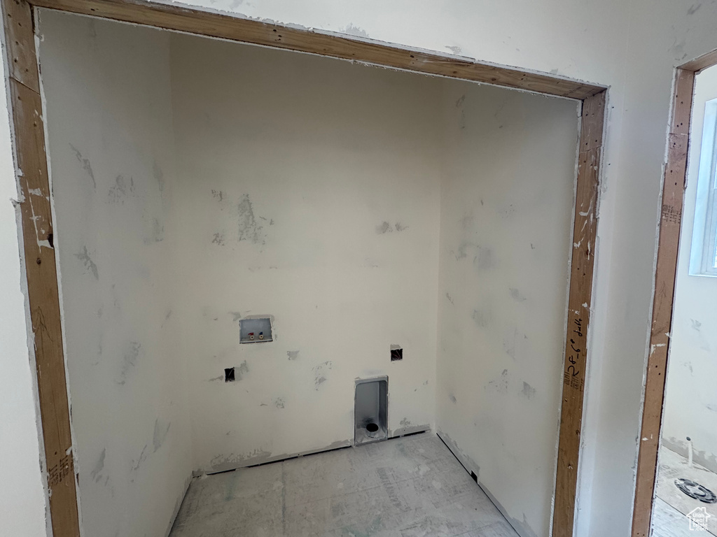 Laundry room with hookup for a washing machine and hookup for an electric dryer