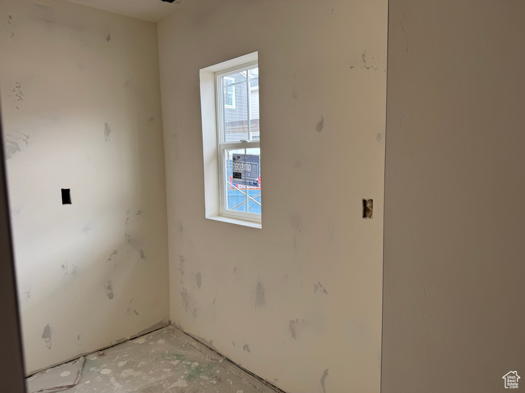 Unfurnished room featuring plenty of natural light