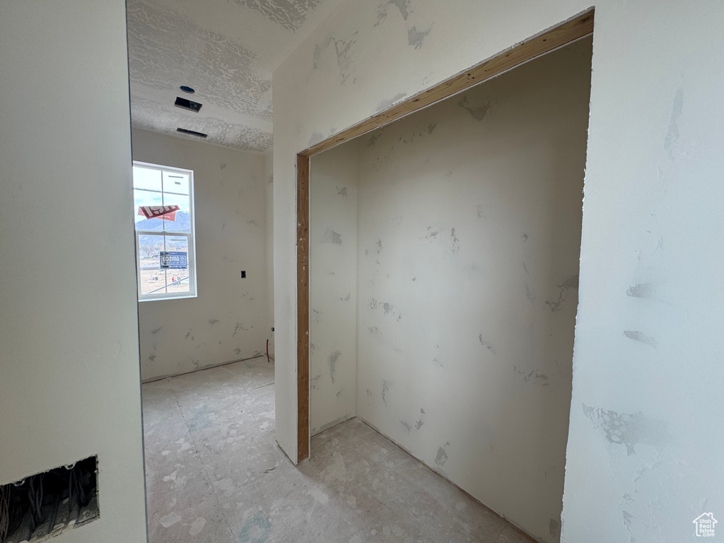 Empty room featuring a textured ceiling