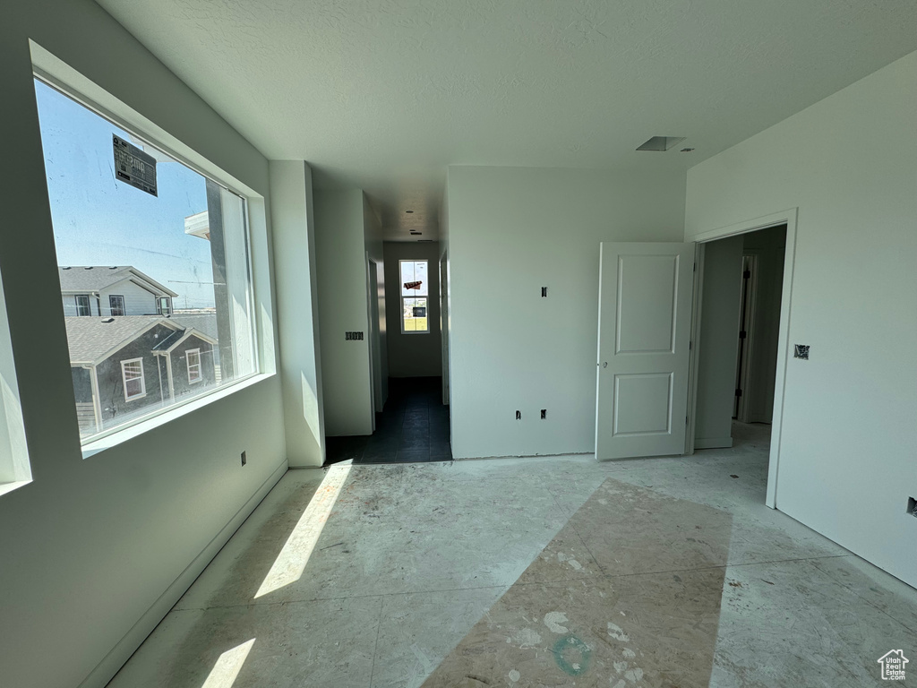 Spare room featuring a textured ceiling