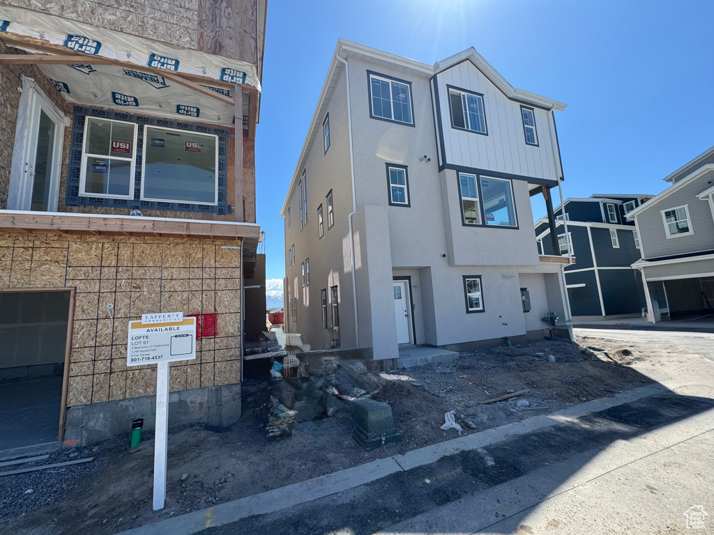 Unfinished property featuring stucco siding