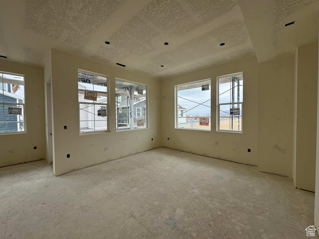 Empty room featuring a textured ceiling