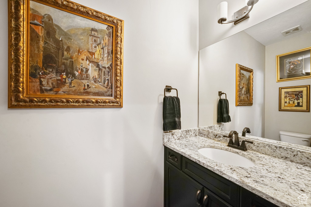 Half bath with vanity and toilet