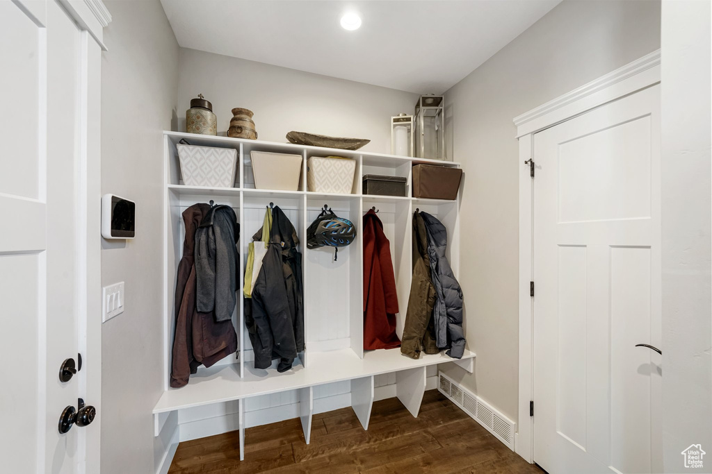Mudroom featuring wood finished floors and baseboards