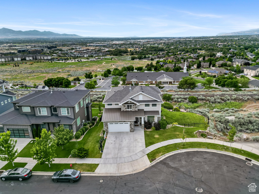 Aerial view of residential area with a mountainous background