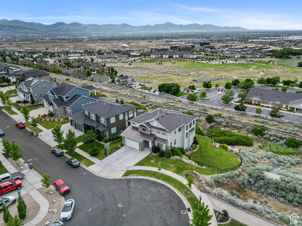 Aerial view of residential area featuring mountains