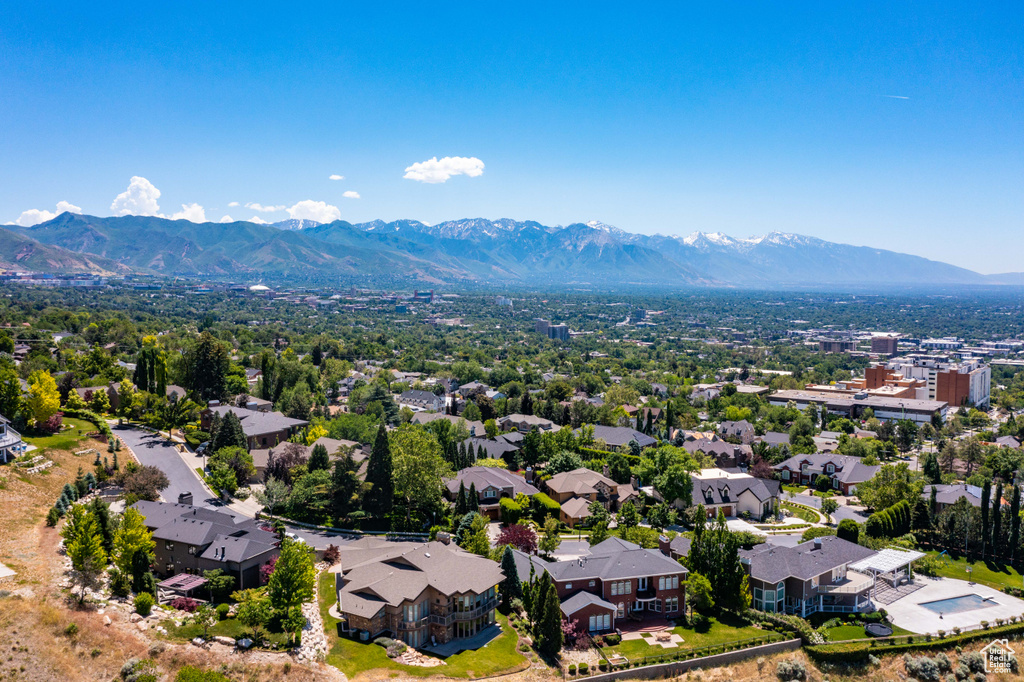 Aerial perspective of suburban area with a mountain backdrop