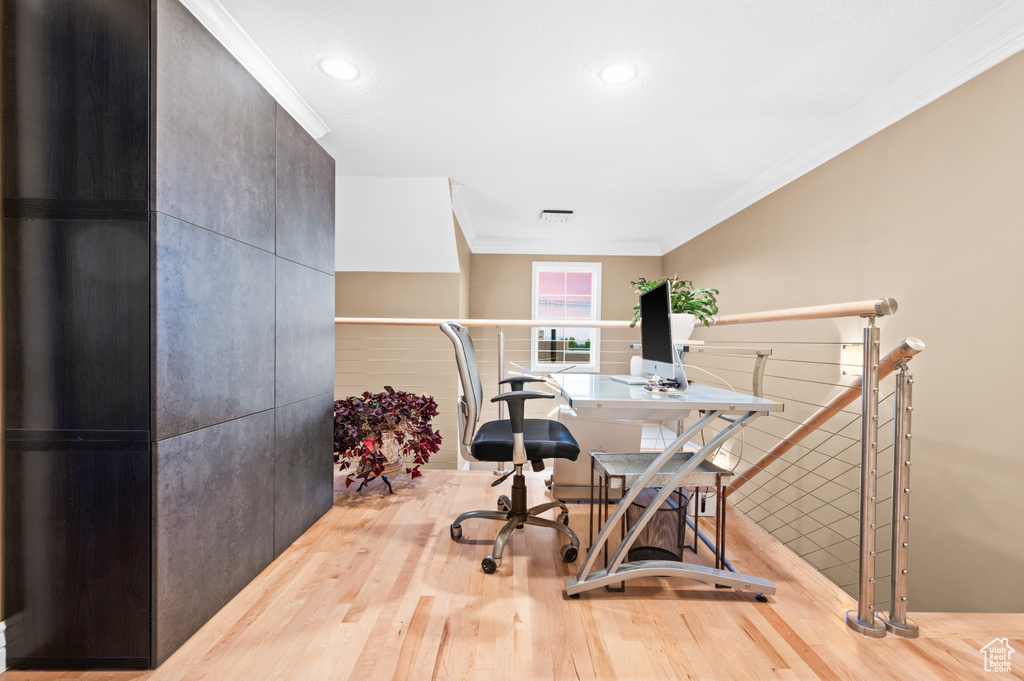 Office area with wood finished floors, ornamental molding, and recessed lighting