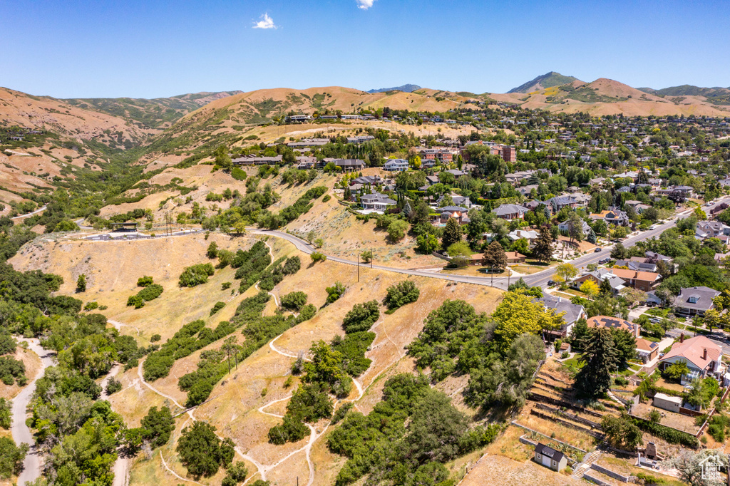 Aerial perspective of suburban area featuring a mountainous background
