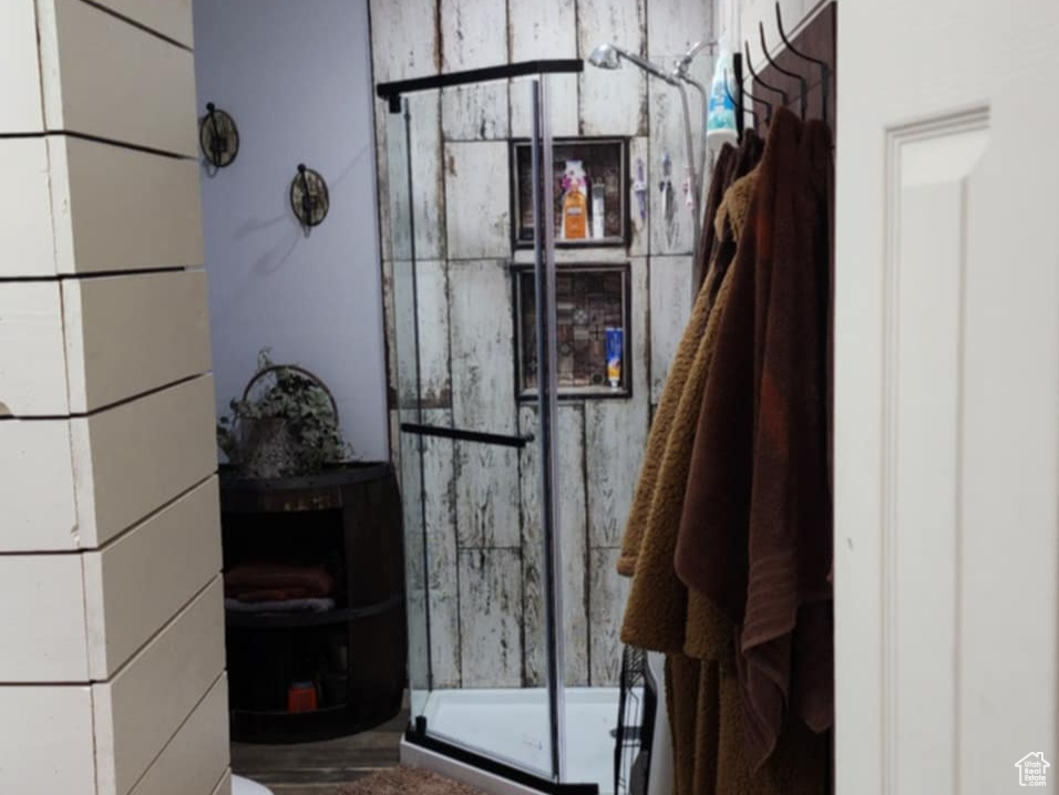 Mudroom featuring wood finished floors and a textured ceiling