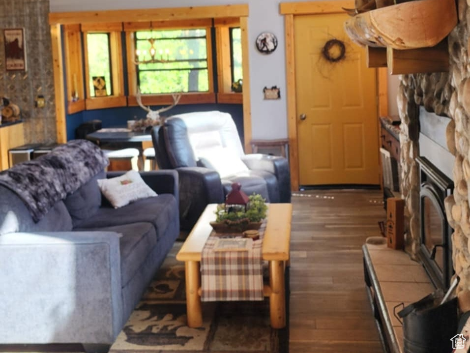 Living area featuring a ceiling fan, wood-type flooring, high vaulted ceiling, and wood ceiling