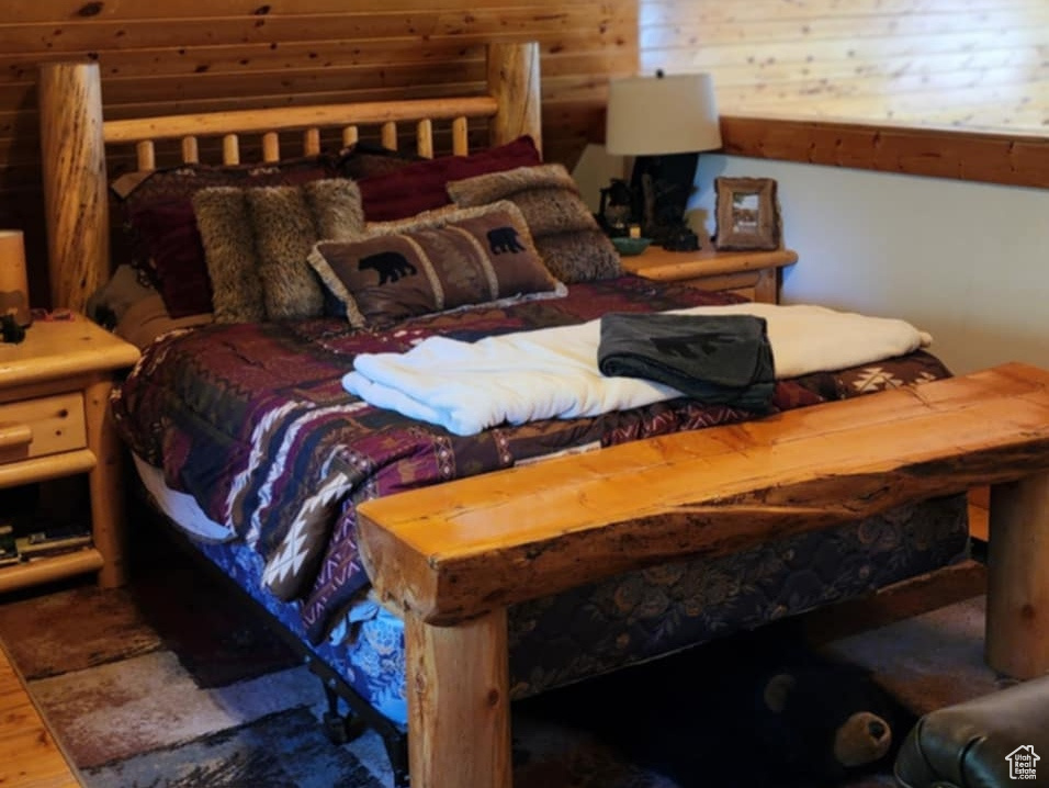 Bedroom with wood finished floors and ceiling fan