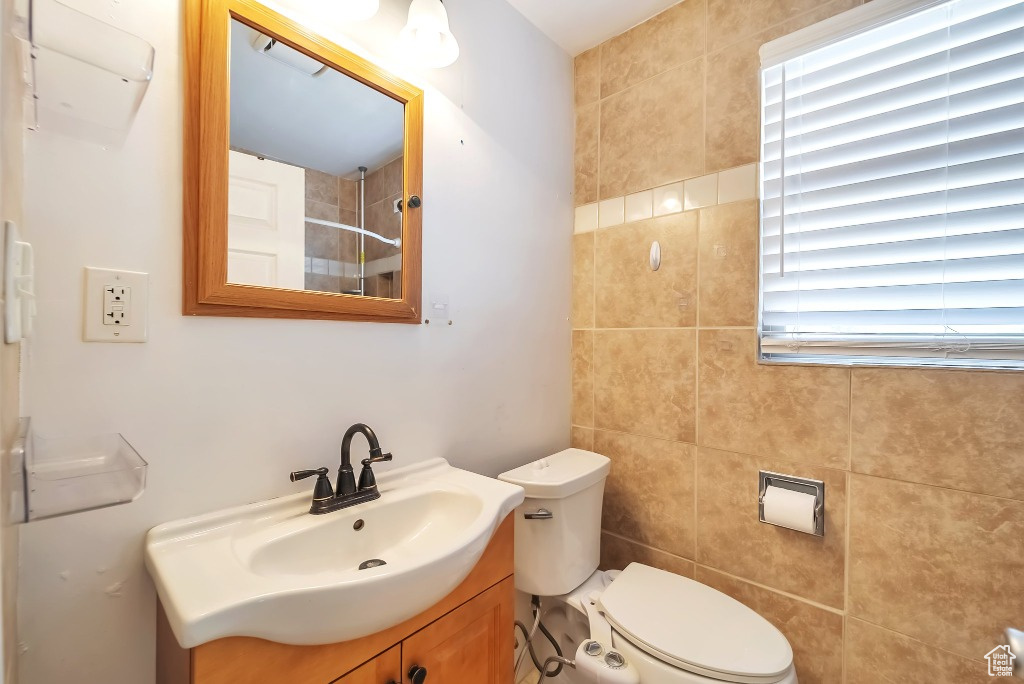 Full bath with vanity and a shower