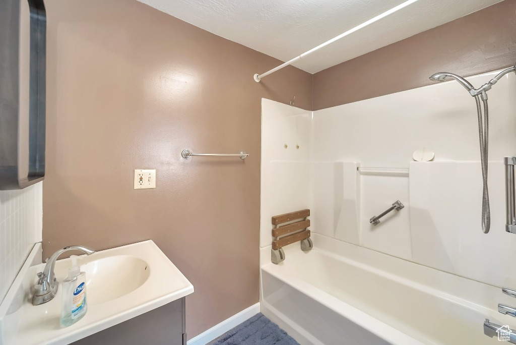 Bathroom with tub / shower combination and vanity