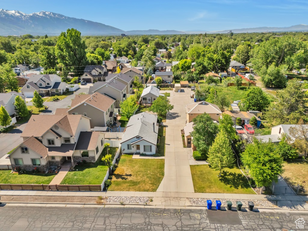 Aerial view of residential area featuring a mountainous background