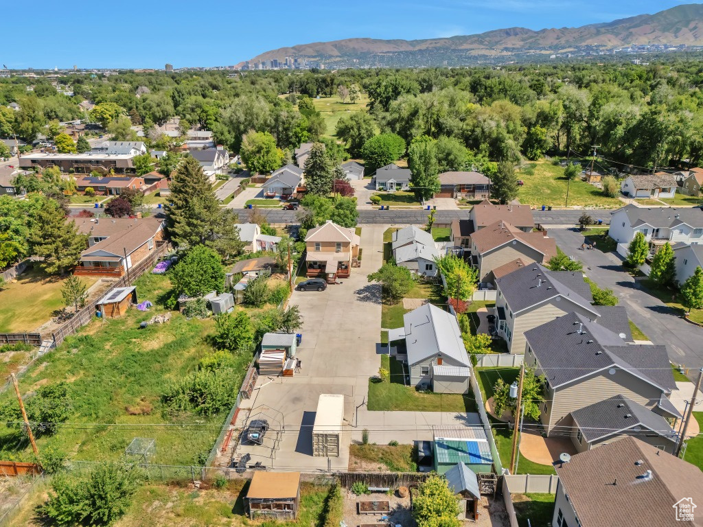 Aerial view of residential area featuring a mountainous background