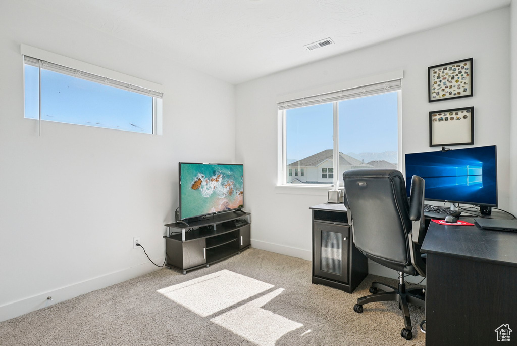 Office area with carpet flooring and baseboards