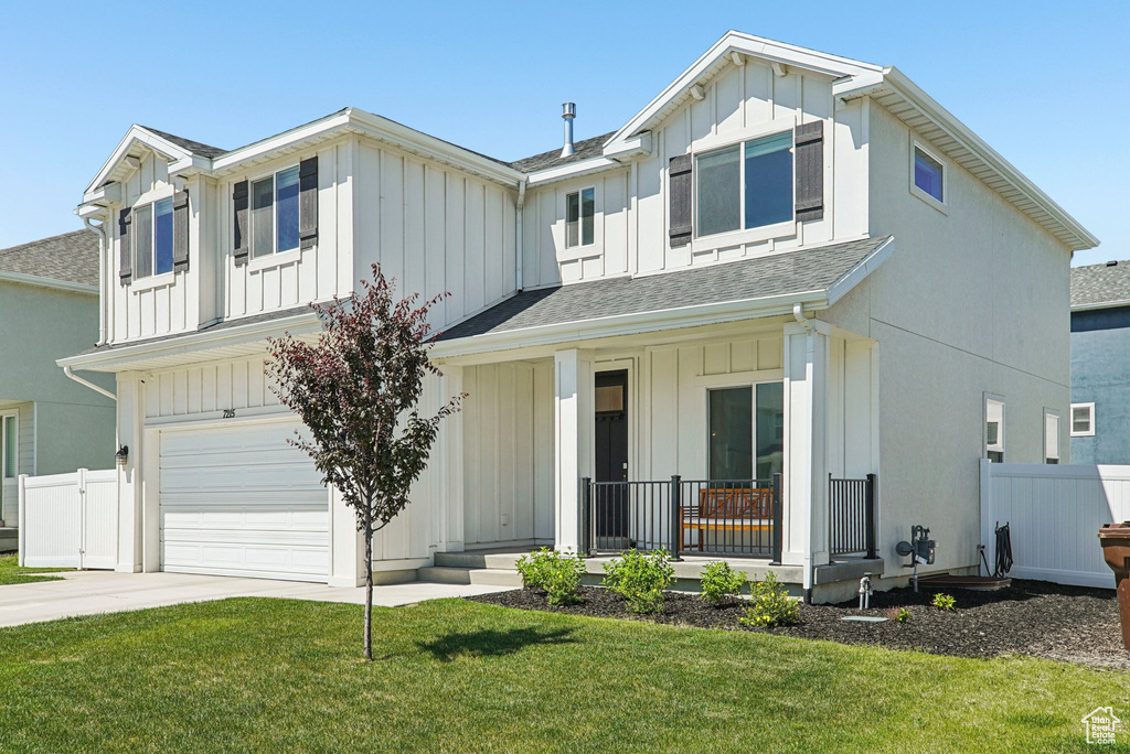 Modern farmhouse style home with a porch, board and batten siding, a garage, roof with shingles, and concrete driveway