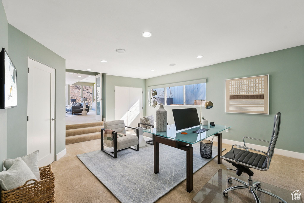Carpeted office space featuring recessed lighting