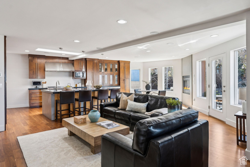 Living area featuring recessed lighting and light wood finished floors