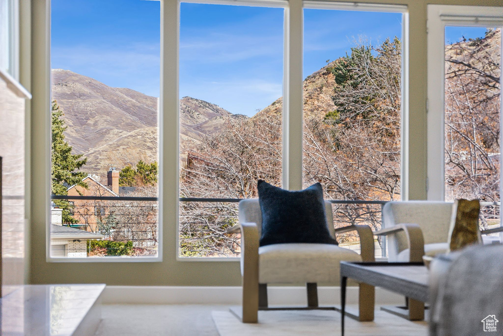 Sitting room with plenty of natural light and a mountain view