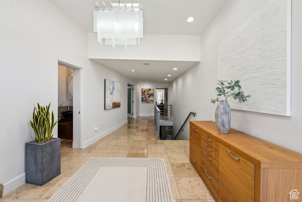 Hall with an upstairs landing and recessed lighting