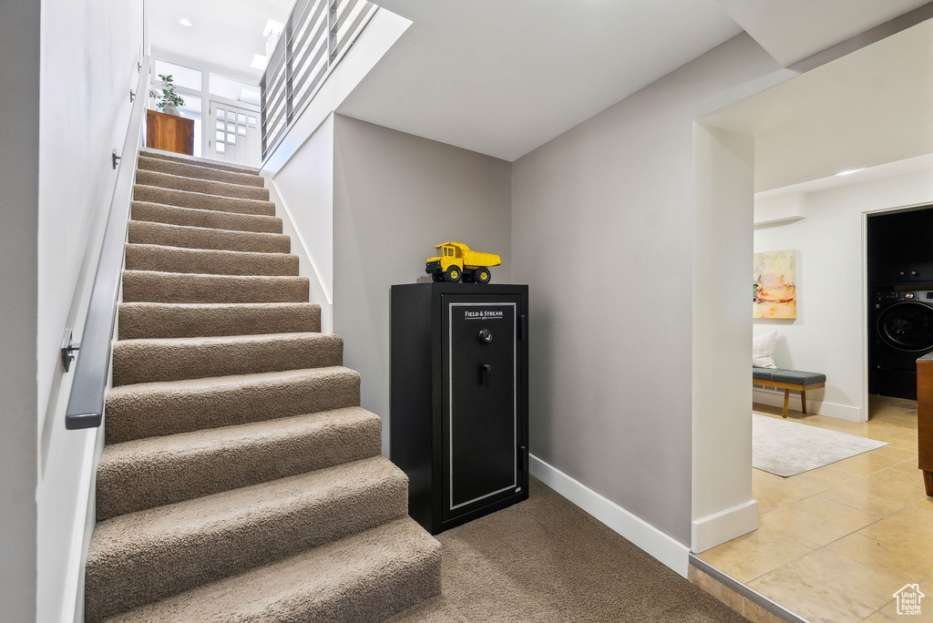 Stairs featuring washer / clothes dryer and baseboards