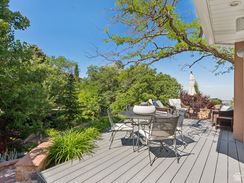 Wooden deck featuring outdoor dining space