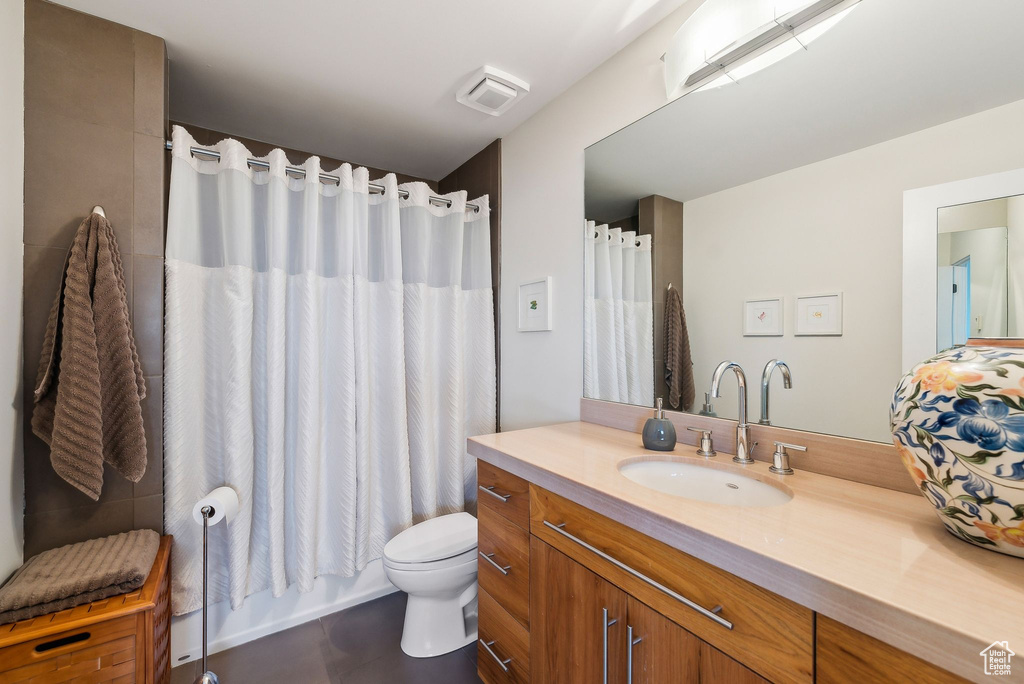 Full bathroom with vanity and tile patterned floors