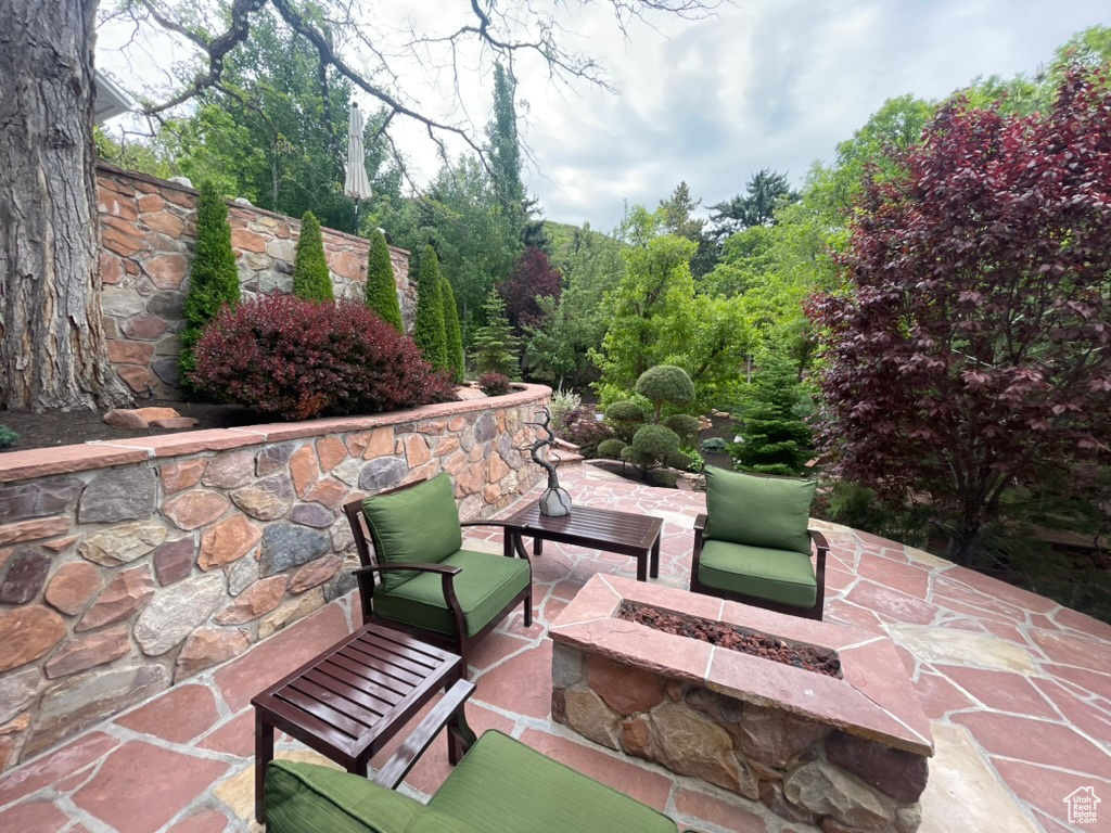 View of patio featuring an outdoor fire pit