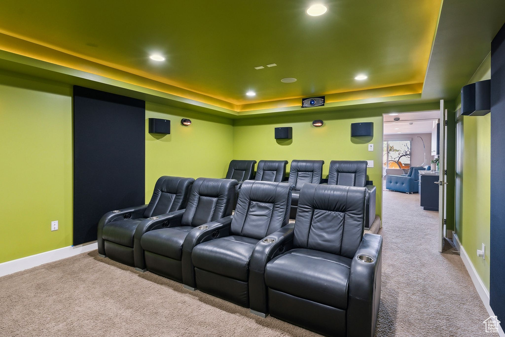 Cinema featuring carpet, a raised ceiling, and recessed lighting