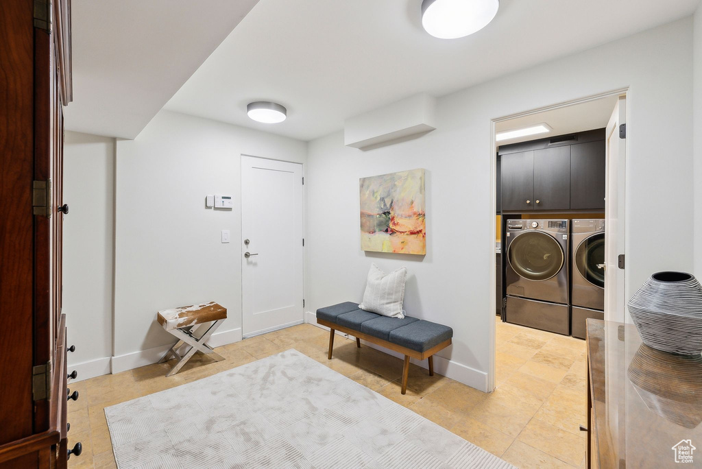 Entryway featuring washer and dryer and baseboards