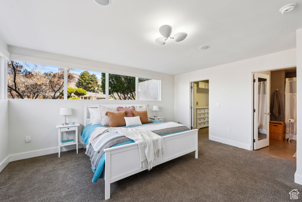 Carpeted bedroom featuring baseboards