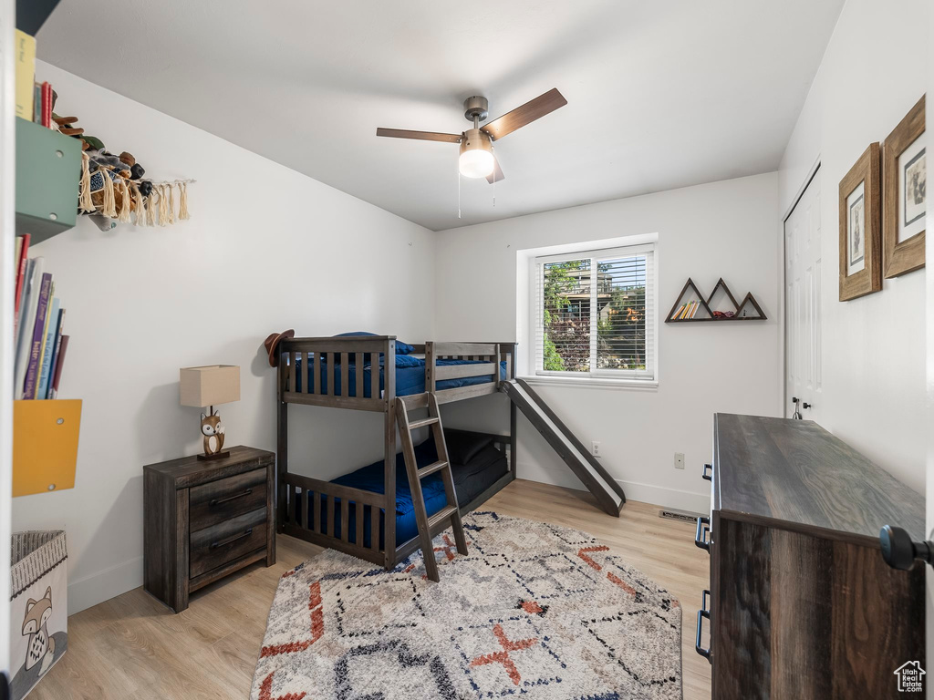 Bedroom featuring light wood finished floors and ceiling fan
