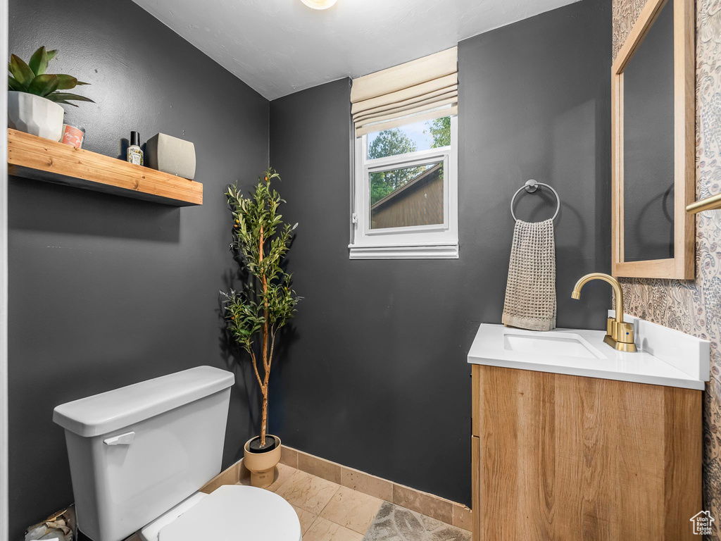 Bathroom with toilet and vanity