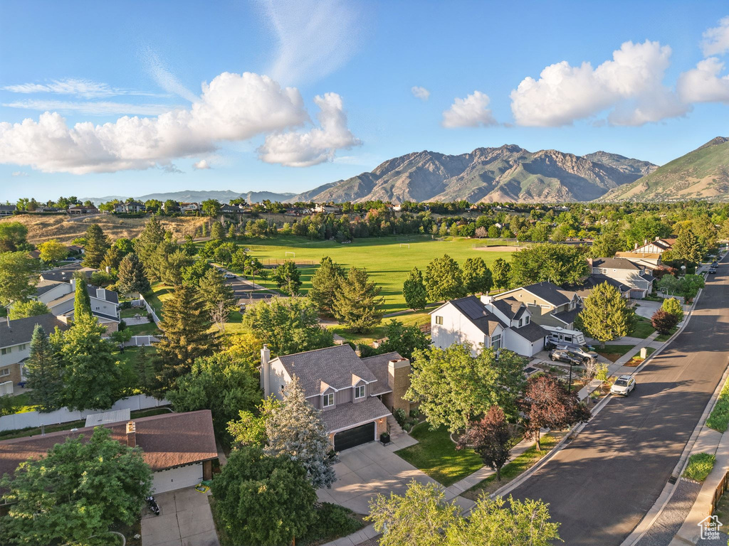 Aerial view of residential area featuring a mountainous background
