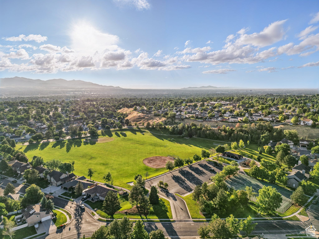 Aerial perspective of suburban area with a mountainous background