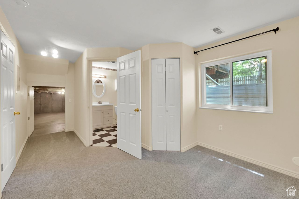 Unfurnished bedroom with carpet floors and a closet