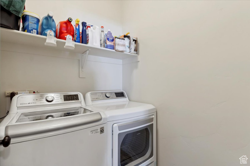Laundry area with washing machine and clothes dryer