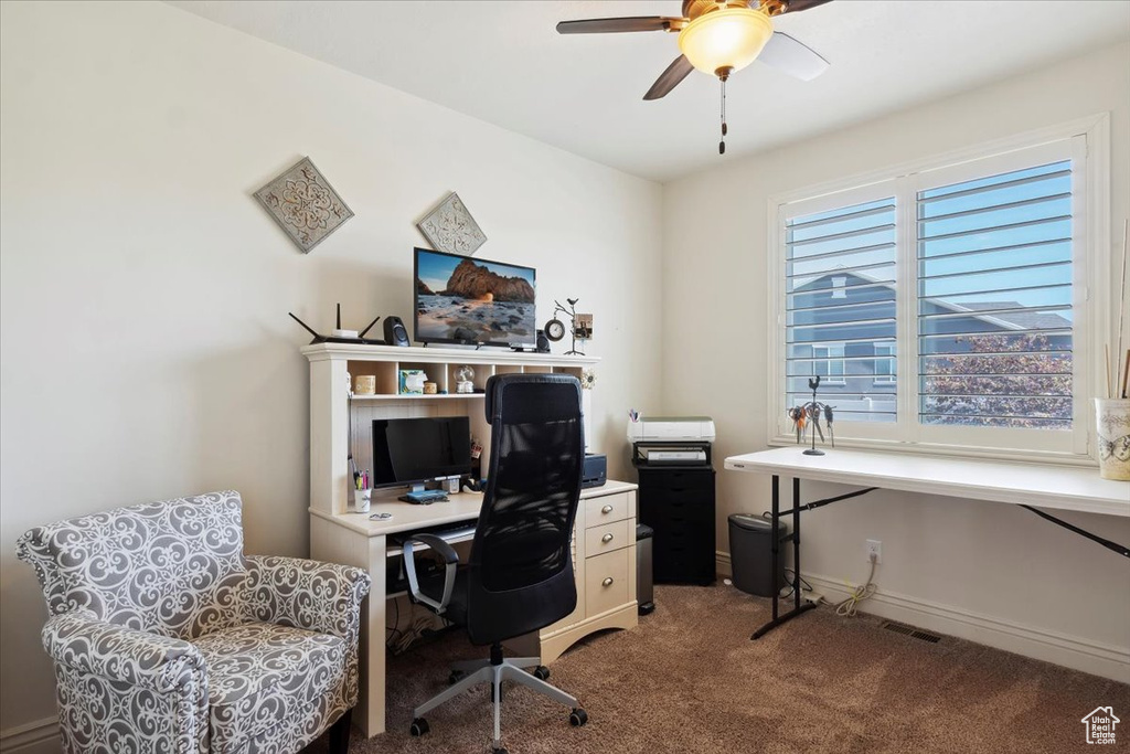 Home office featuring carpet floors and ceiling fan