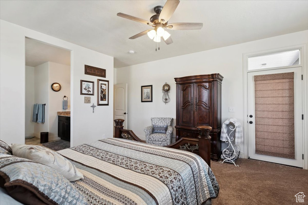 Bedroom featuring carpet flooring, a ceiling fan, and ensuite bathroom