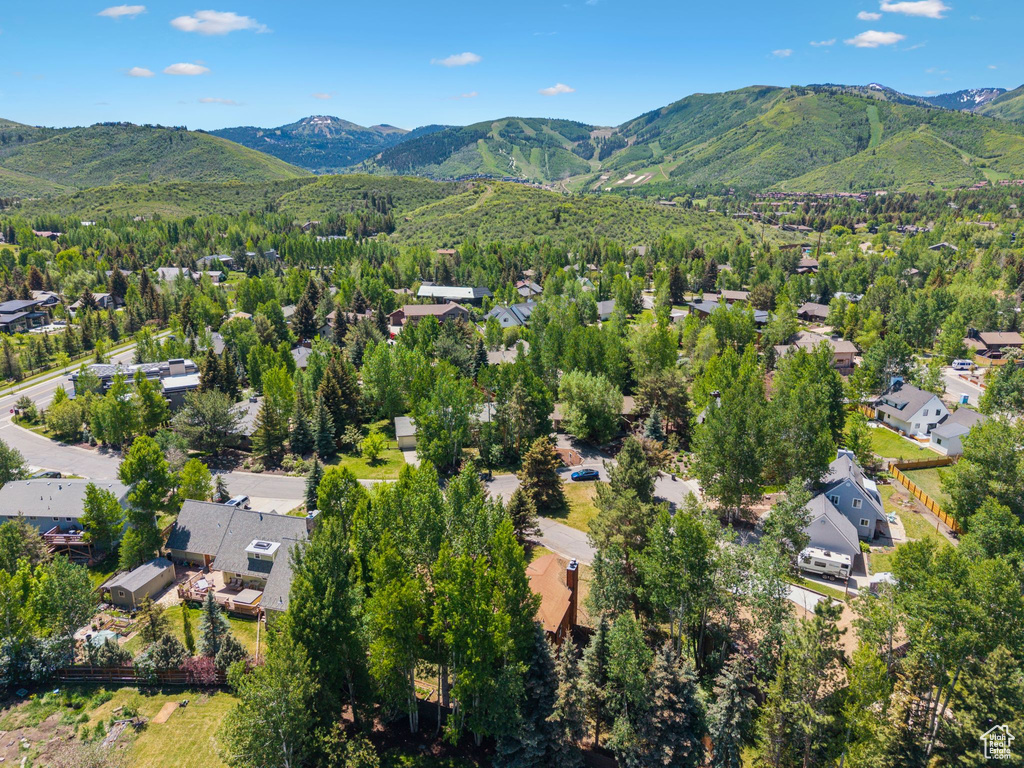 Aerial view of residential area featuring a mountain backdrop