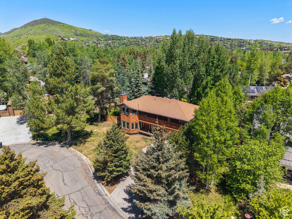 Drone / aerial view of mountains and a heavily wooded area