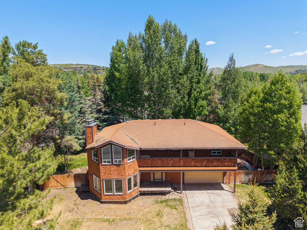 View of subject property featuring a heavily wooded area