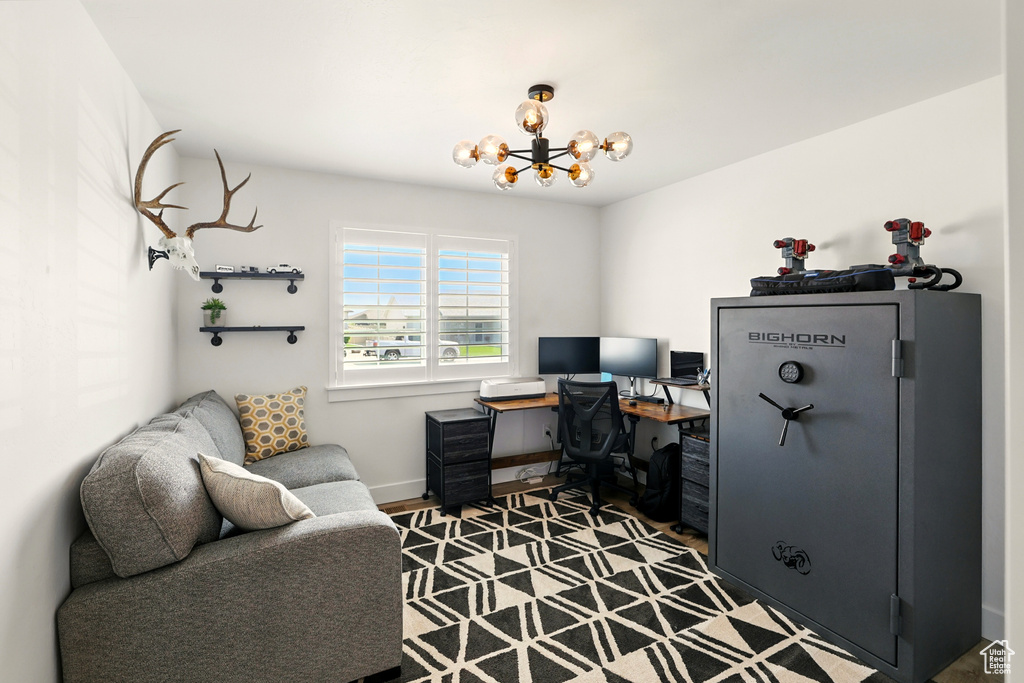 Office with a chandelier and baseboards