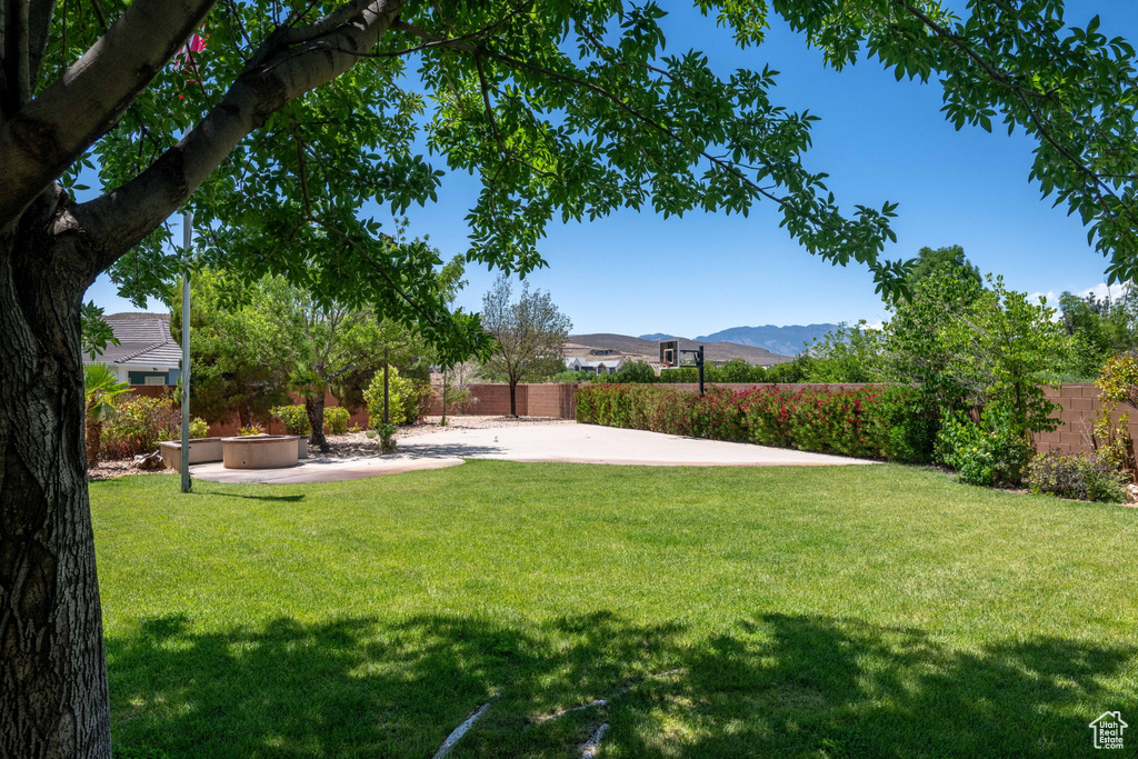 View of yard featuring a mountain view and a patio