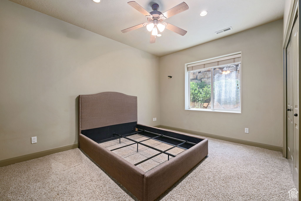 Bedroom with carpet floors, recessed lighting, a closet, and ceiling fan