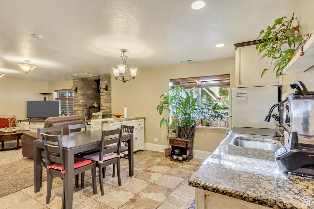 Dining area featuring a chandelier and recessed lighting