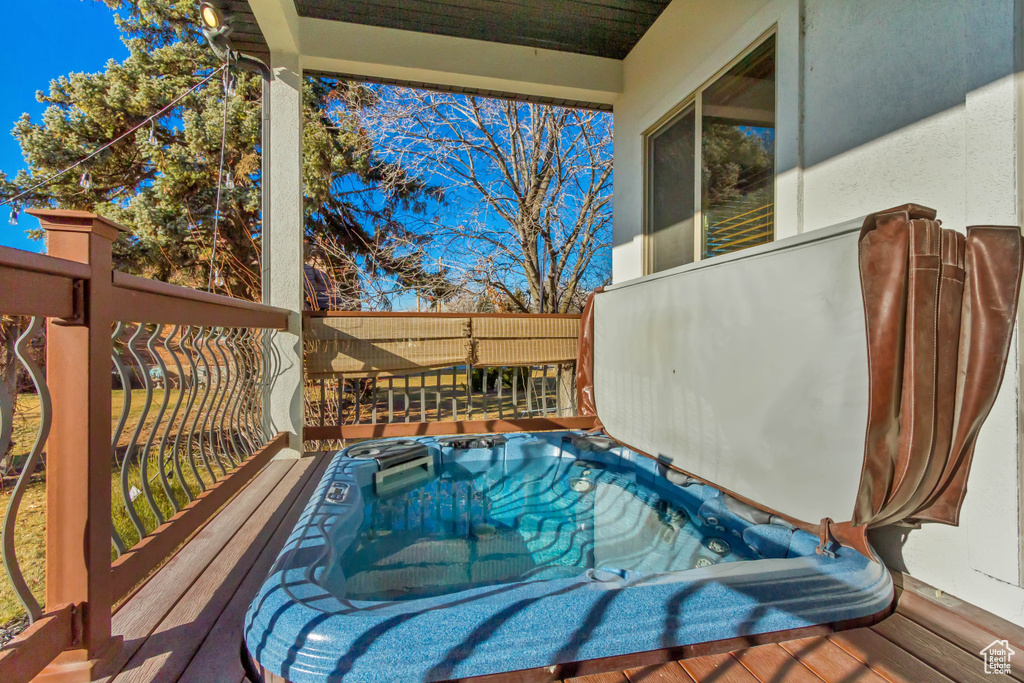 Wooden deck with a covered hot tub