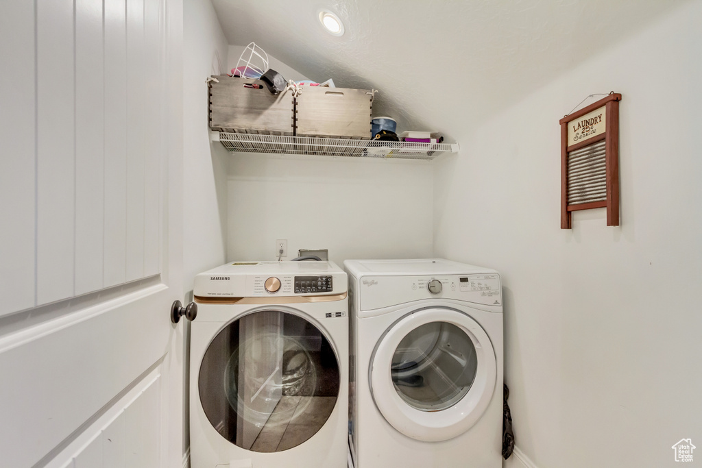 Washroom featuring washing machine and clothes dryer